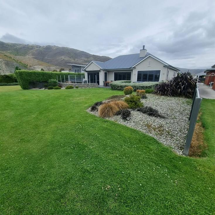 Landscaped residential yard in Central Otago with reshaped garden and lawn