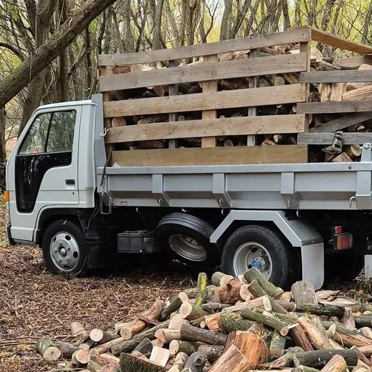 Truck delivering stacked dry willow firewood across Central Otago region