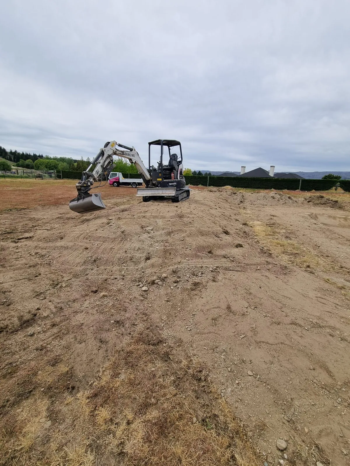 Mini digger working on a lifestyle block site preparation in Alexandra, Central Otago