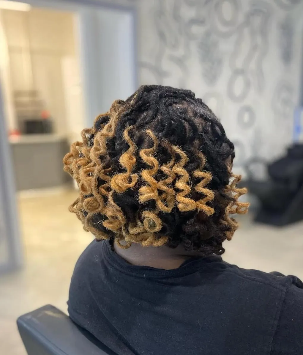 Stunning long loc extensions demonstrating undetectable integration and mature appearance.