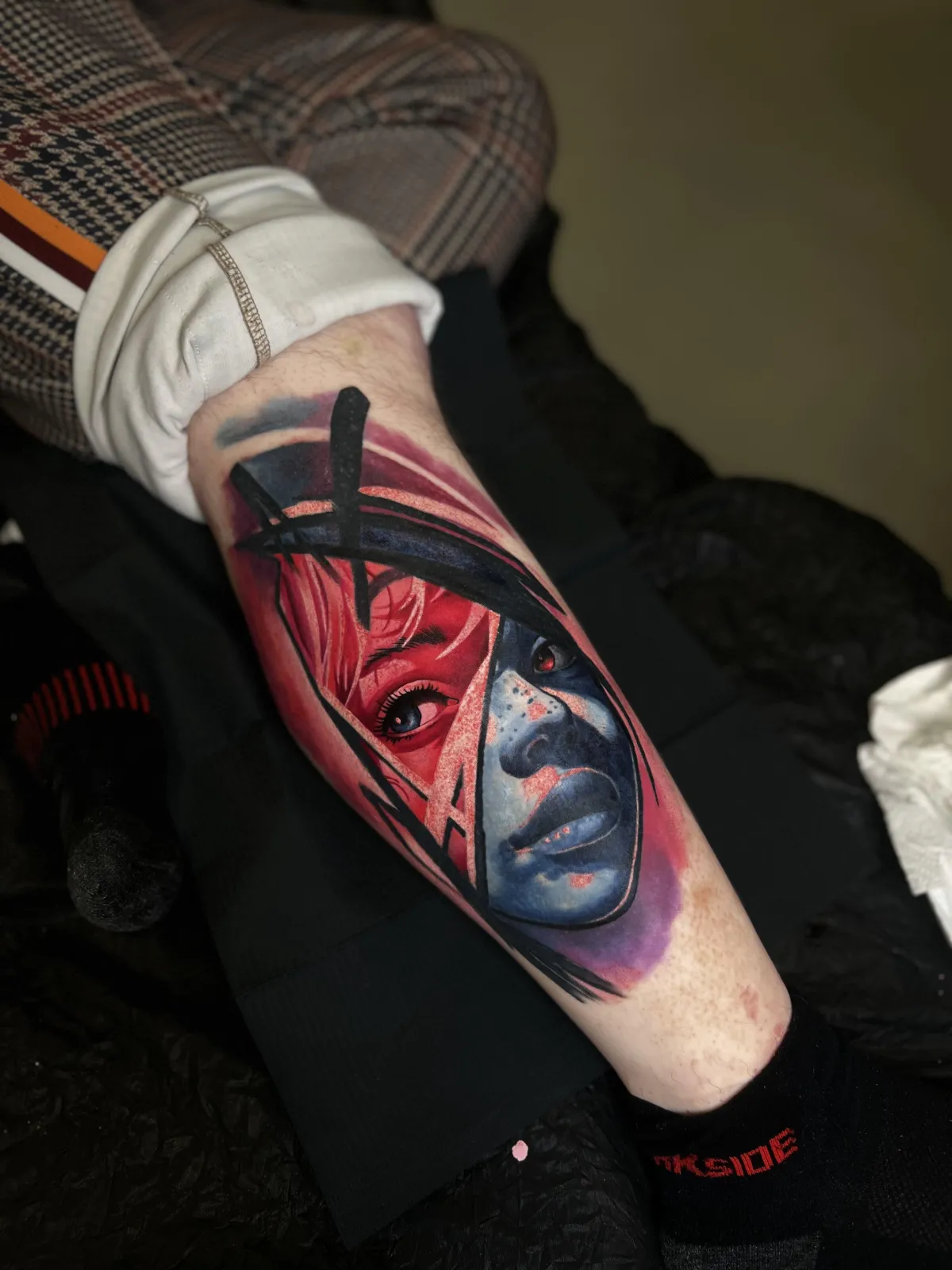 person with tattoo on right arm