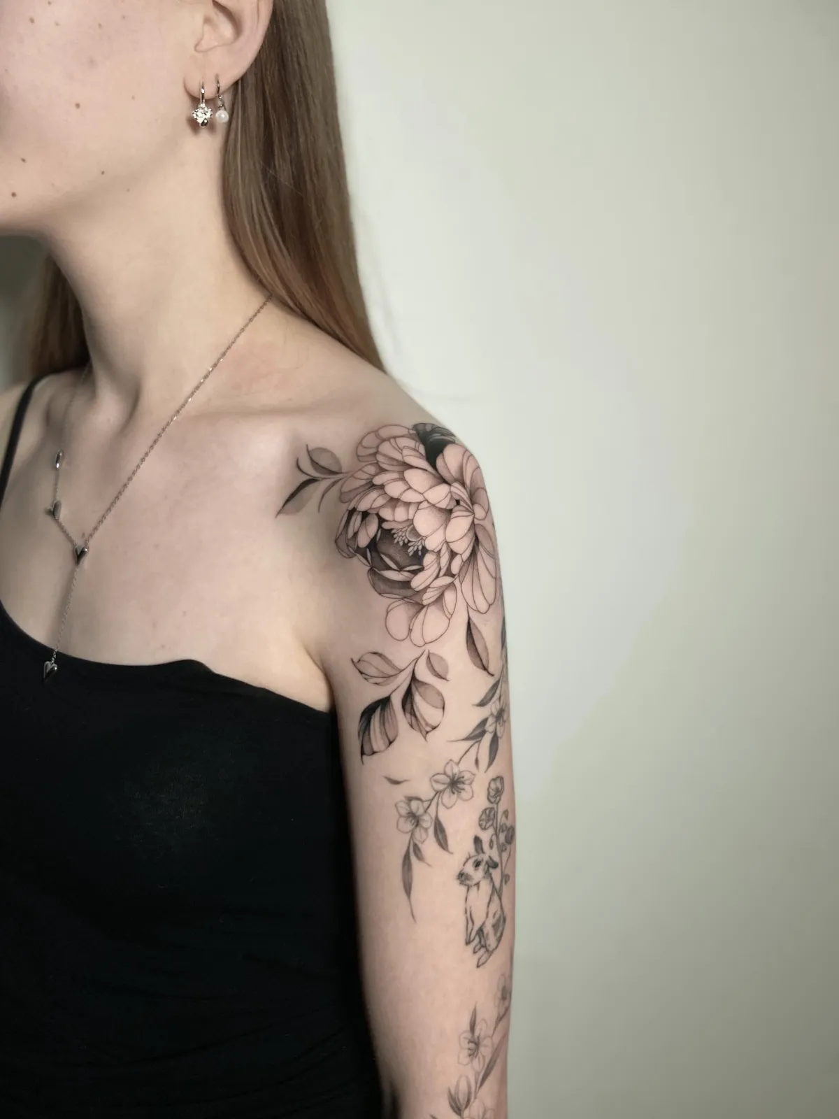 person with tattoo on right arm