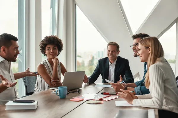 Business Professionals sitting at a meeting table