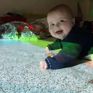 Baby engaging in self-guided sensory exploration