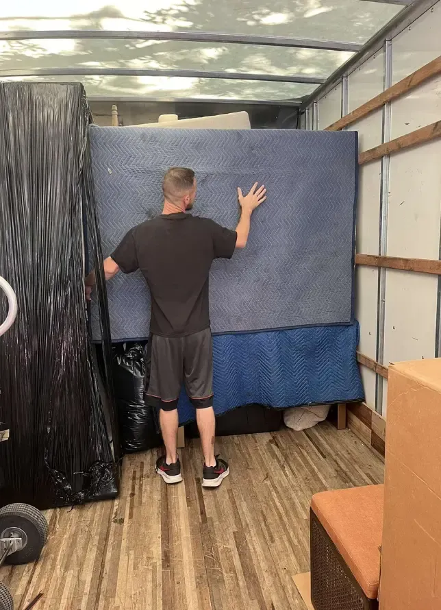 Local moving company safely transporting large furniture in Manchester CT
