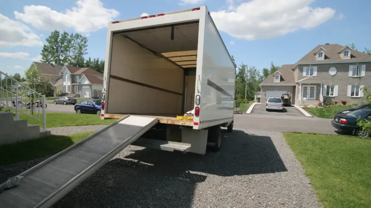 Experienced moving company carrying wrapped furniture inside a home in Manchester CT