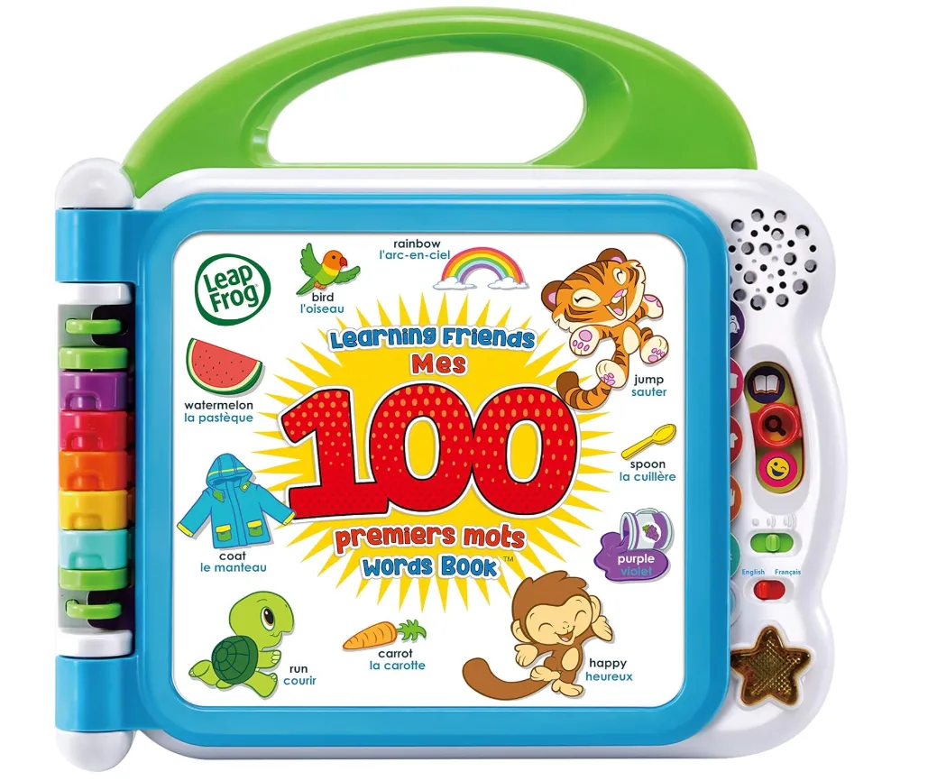 Laptop screen displaying code with glasses and plush toy.