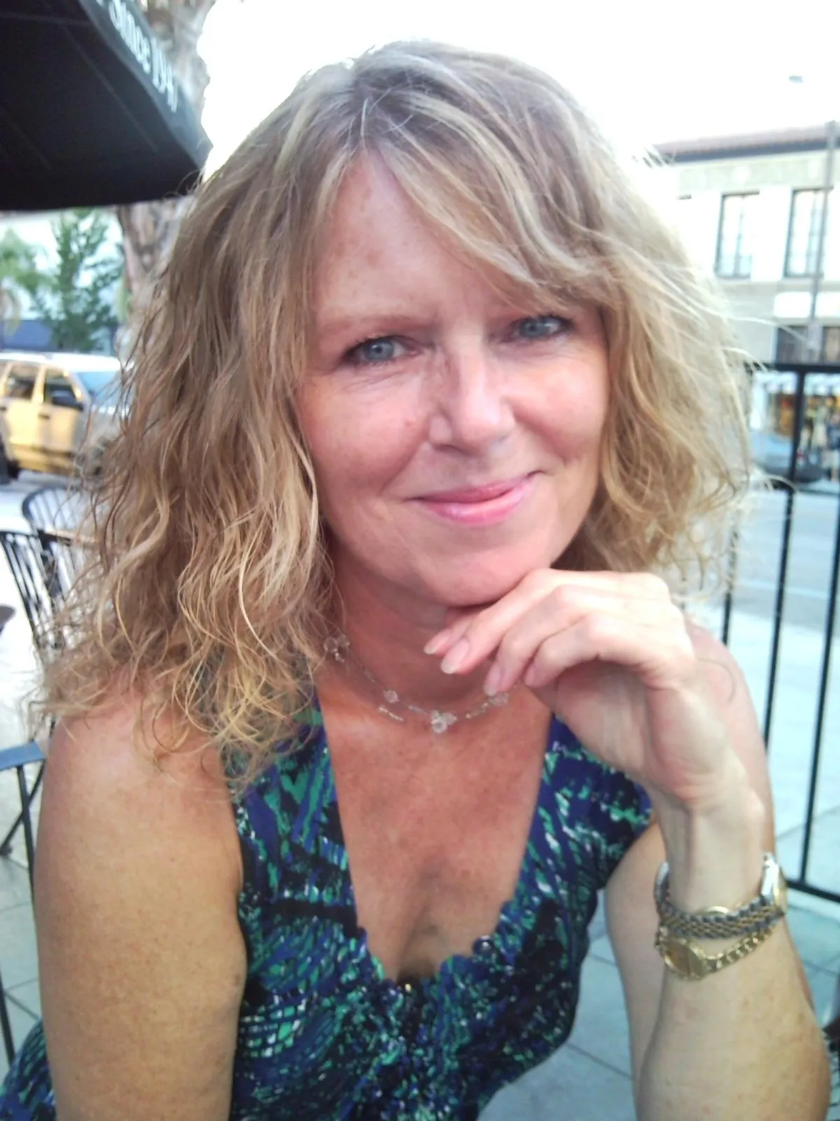 A gentle, sunlit photograph of a peaceful garden path lined with blooming flowers, dappled with golden afternoon light. The scene evokes tranquility and remembrance, with soft focus and warm, comforting colors, symbolizing a journey of life and the beauty of cherished memories.