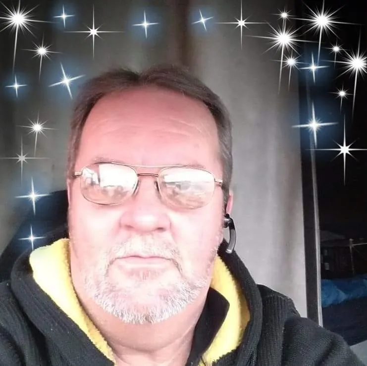 A large group of people standing in a field