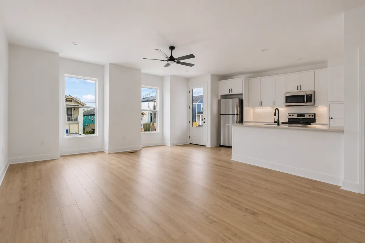 Open living room and kitchen in a new-construction duplex unit, New Orleans