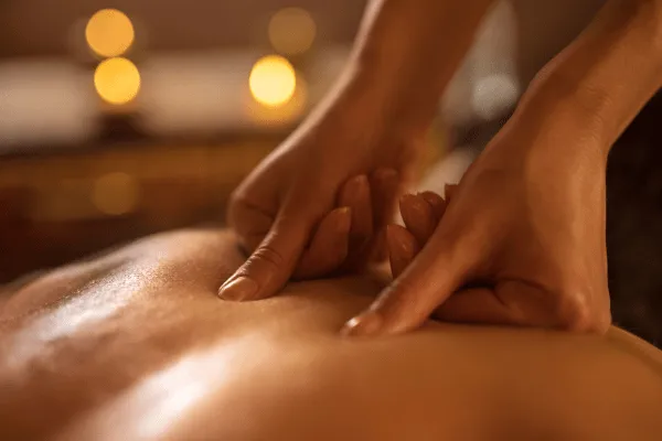 Certified spa therapist performing deep tissue massage using expert techniques at Impression Spa in Tampa, FL
