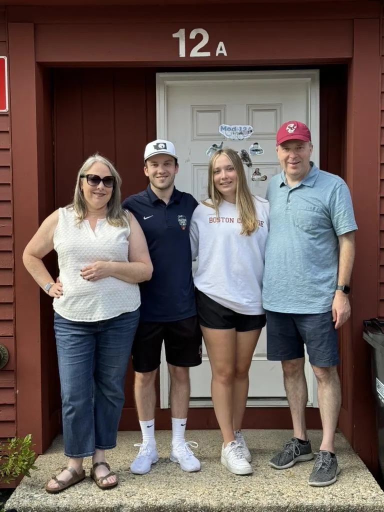 A group of people of various ages gathered around a kitchen island, raising glasses in a toast. The scene is bright and cheerful, with natural light and a sense of celebration, symbolizing gratitude and community for new subscribers.