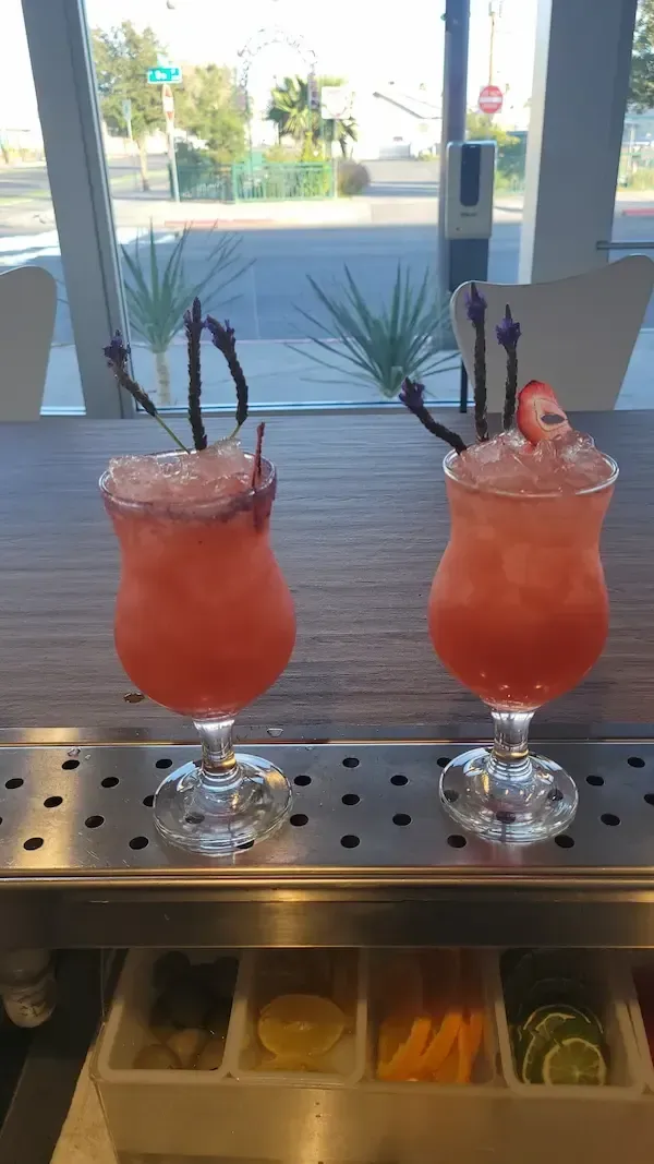 Artisanal pink cocktails garnished with lavender and strawberry, Avilez Mobile Bar event bartending Las Vegas
