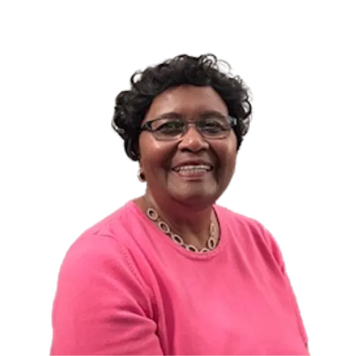 Rev. Dr. Loretta Faye Baker leading a small Bible study in a bright cozy living room.