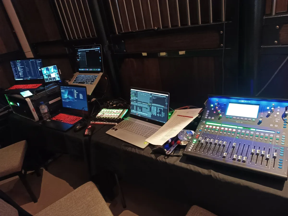 Allen & Heath SQ-5 digital mixing console with multiple production laptops and MIDI controllers for live event audio
