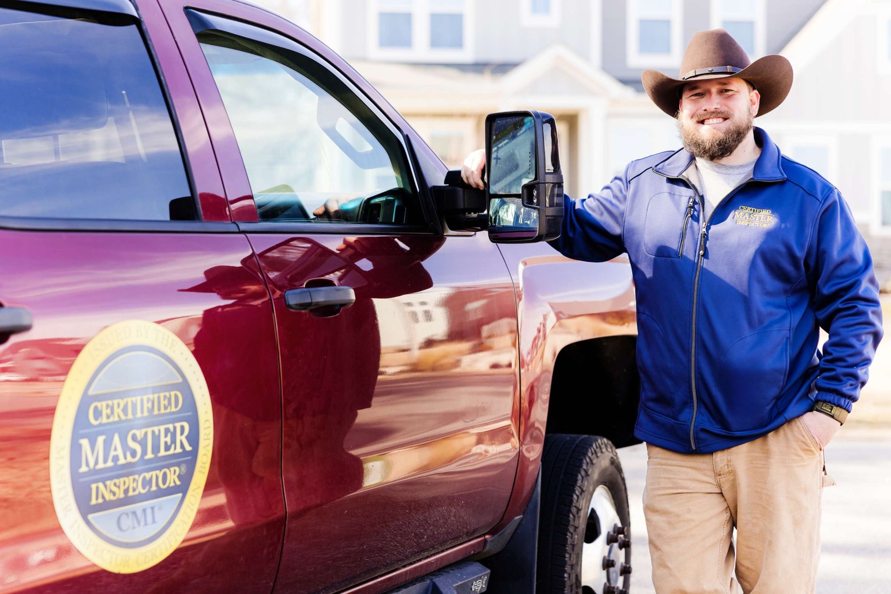 Jarett Vogler of Legacy Home Inspections beside the company inspection truck