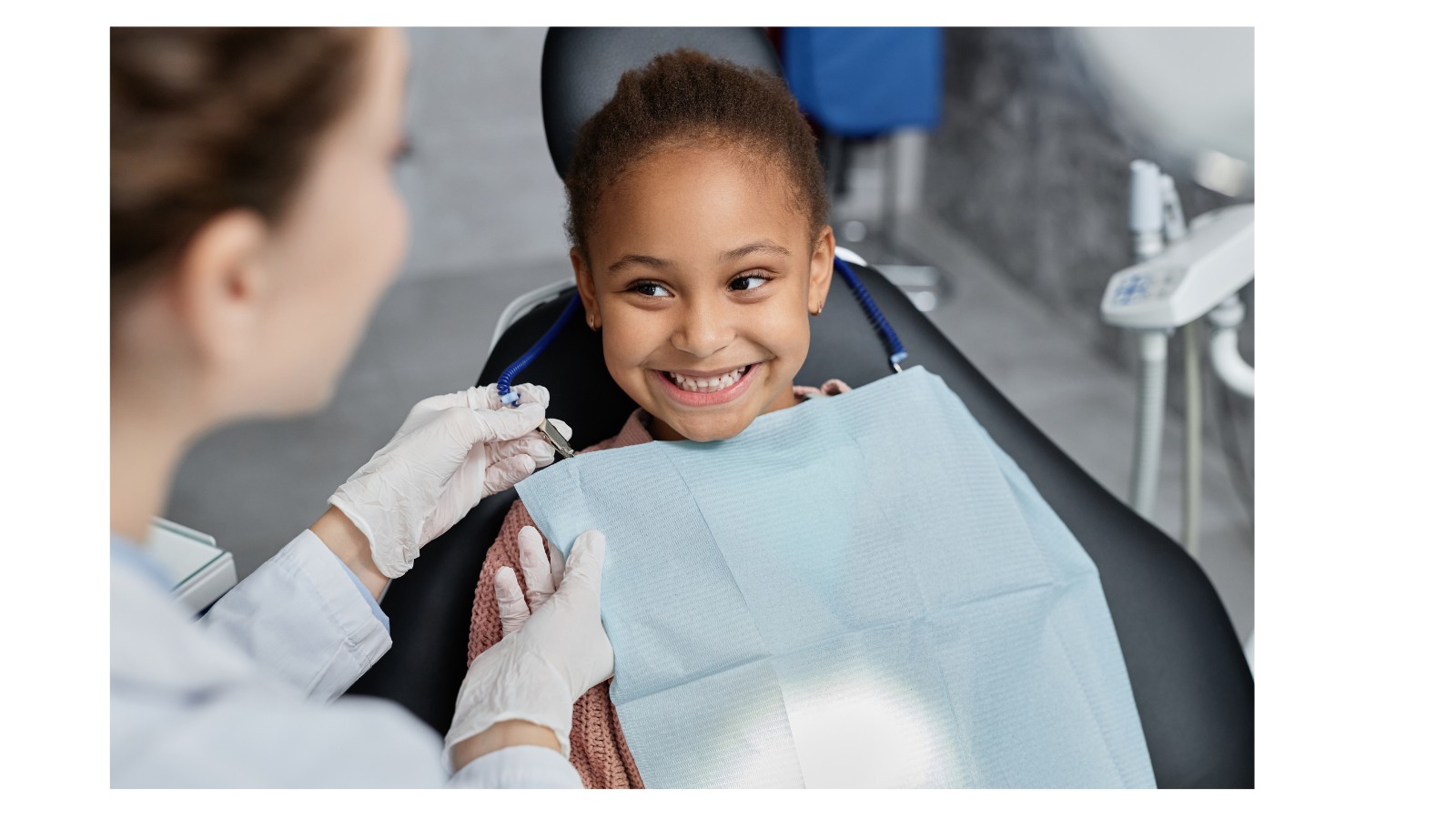 child smiling during pediatric dental checkup in North York Ontario