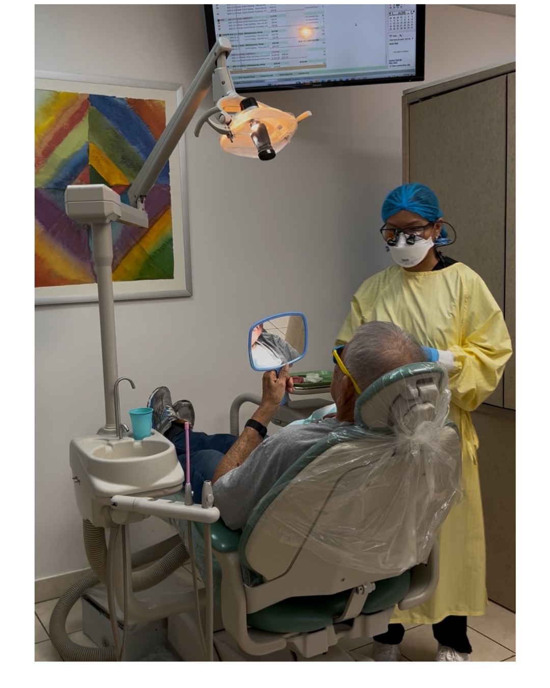 Dentist performing dental treatment on patient at O’Connor Dental Care clinic in North York Ontario