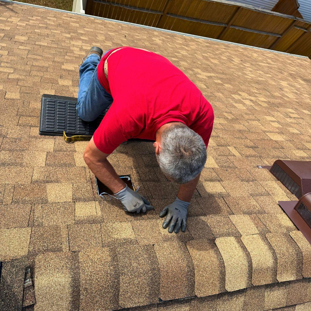 Roof leak repair in Hayden ID - fixing damaged shingles to stop water damage