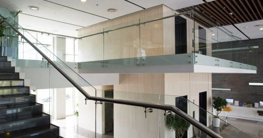 a kitchen with a sink and a lot of clutter on the counter