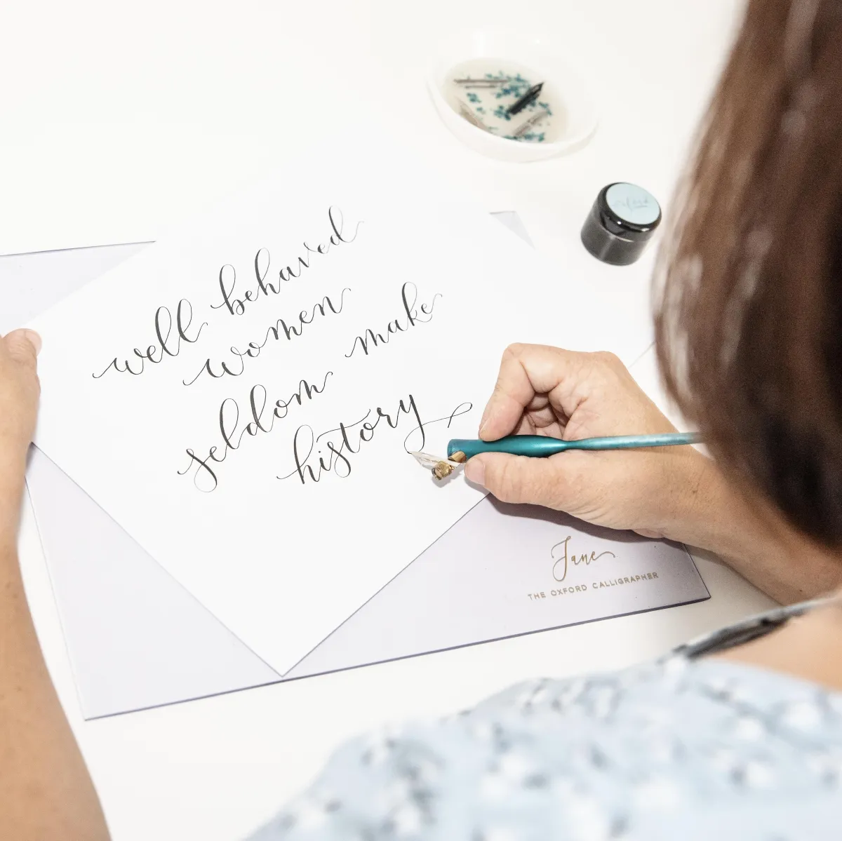 The Oxford Calligrapher writing a calligraphy commission