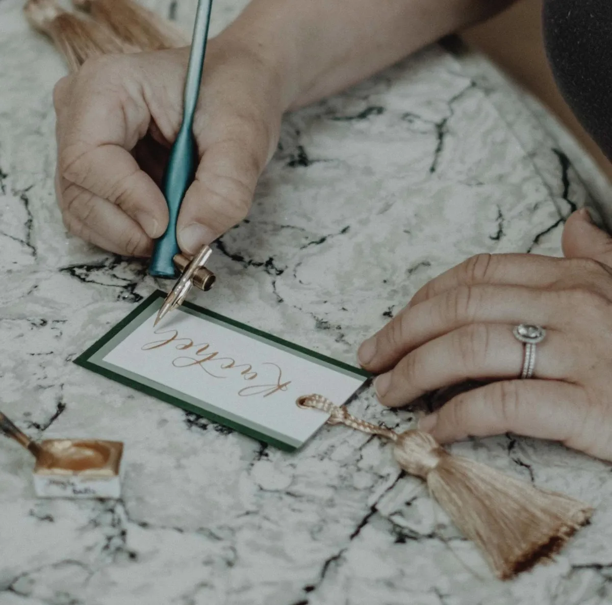 The Oxford Calligrapher writing a calligraphy place card