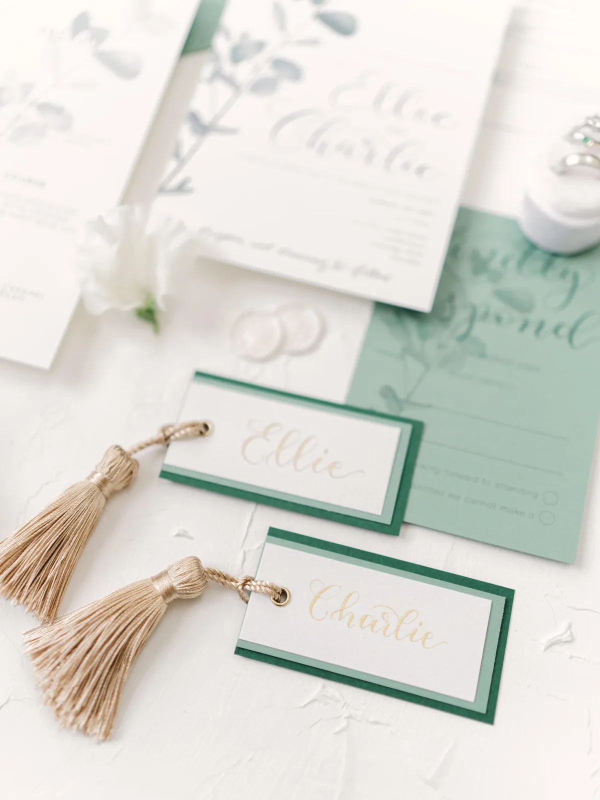 Calligraphy place cards with tassels for weddings and corporate events
