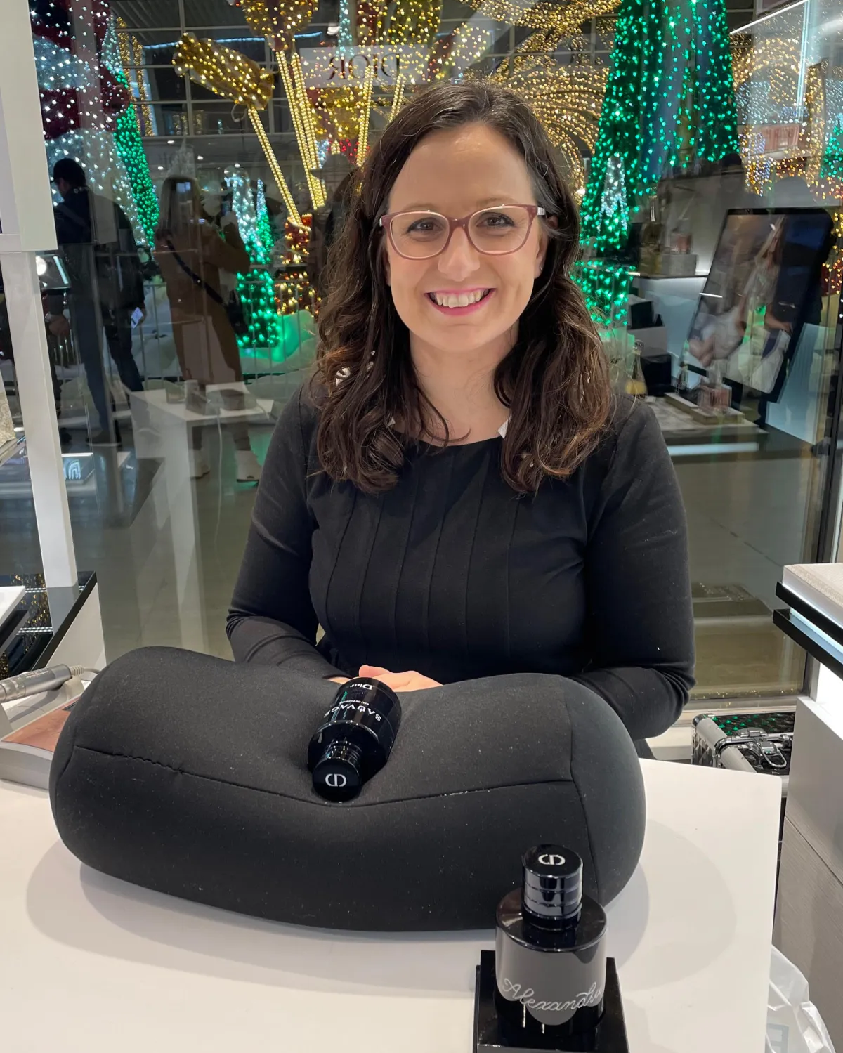 Freehand calligraphy engraving on a bottle of perfume for an in-store event