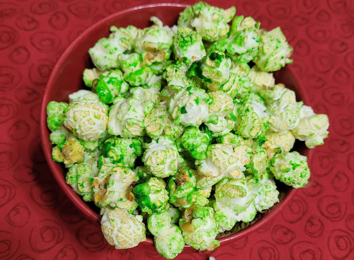 green apple kettle corn popcorn presented in a red bowl