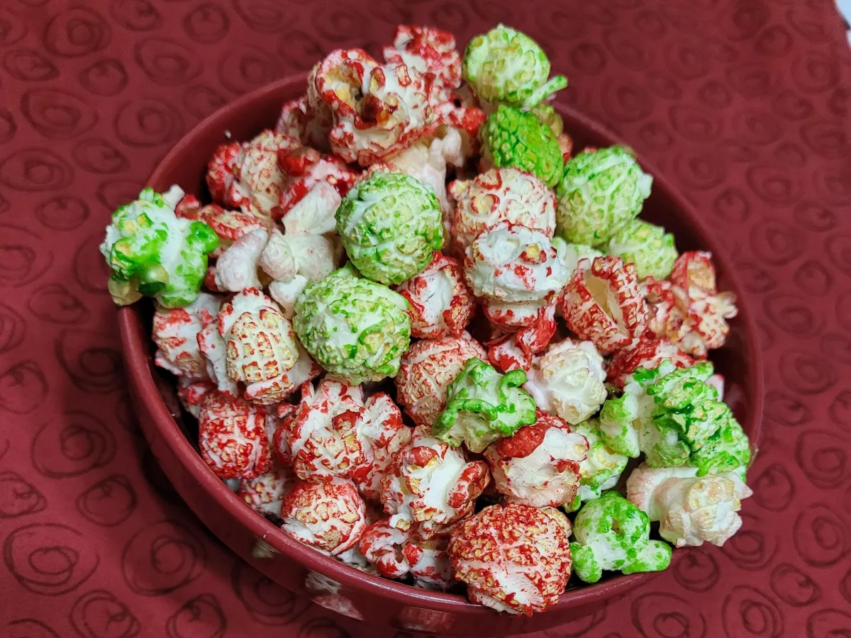 red and green kettle corn popcorn mix presented in a red bowl