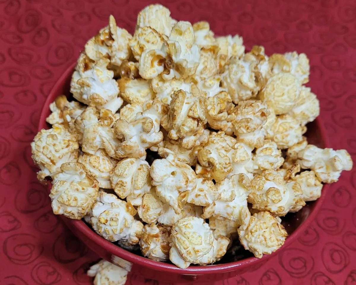 maple butter kettle corn popcorn presented in a red bowl