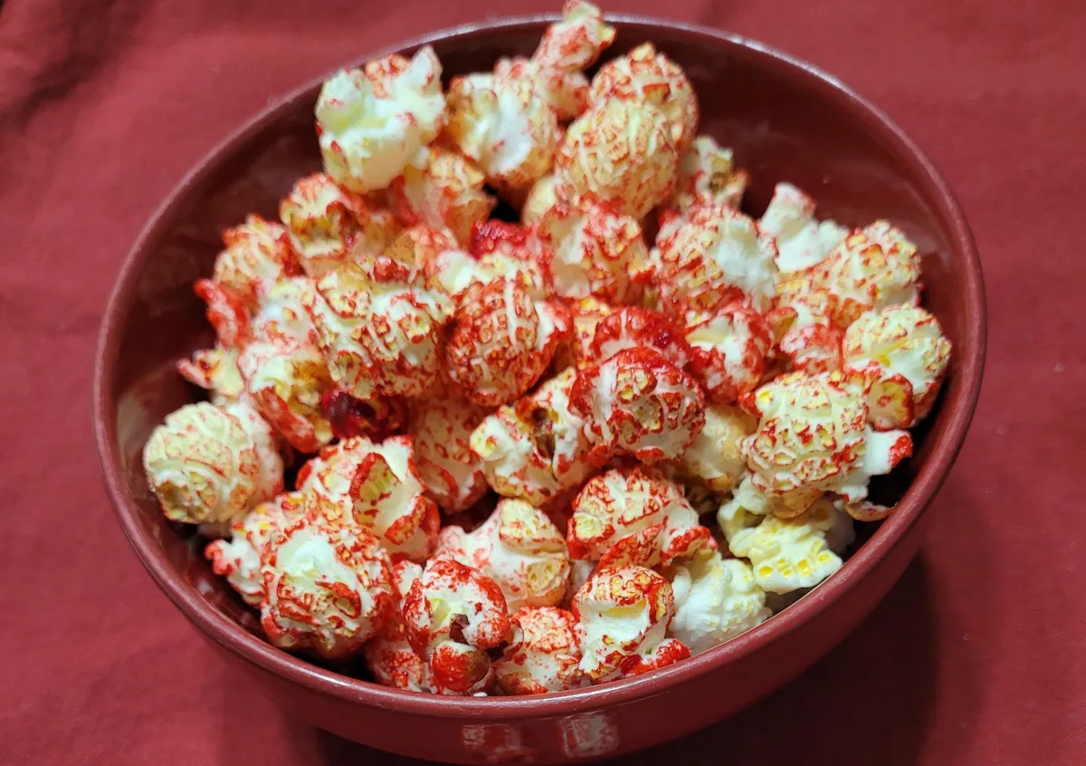 very cherry red kettle corn popcorn presented in a red bowl