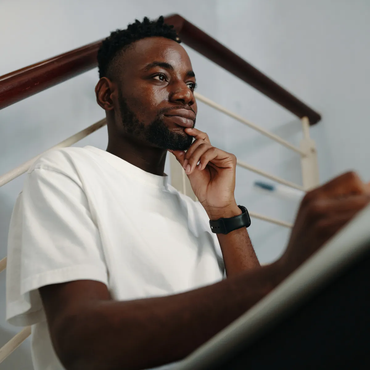 man reflecting and journalling