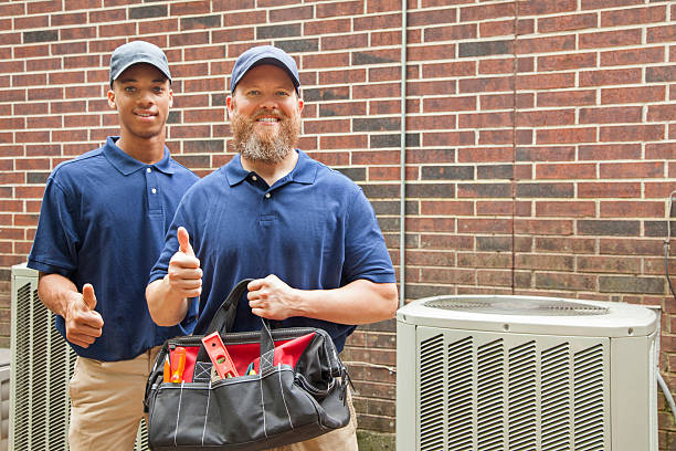 Two Federal Heating and Cooling contractors thumbs up