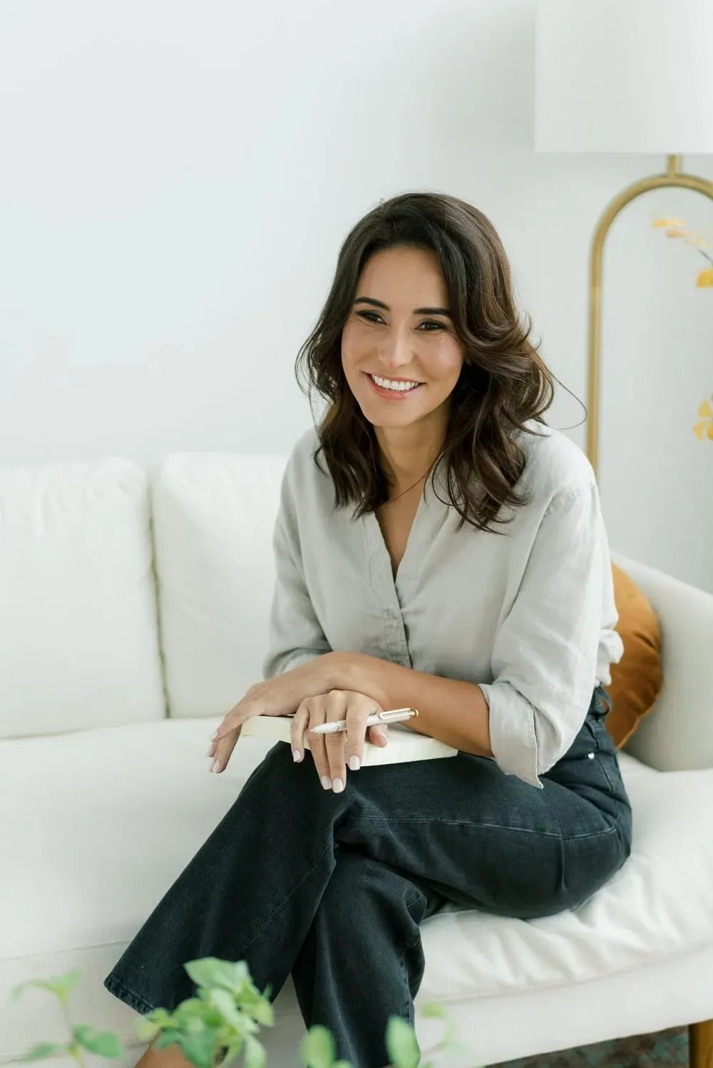 Eva McCage offering intensive therapy support, seated in a modern therapy room with calming tones