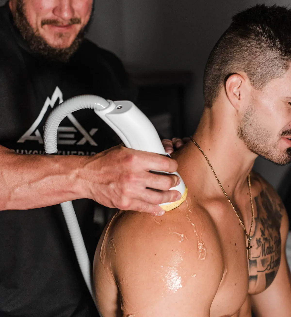 softwave wand being used by physical therapist on patient's shoulder