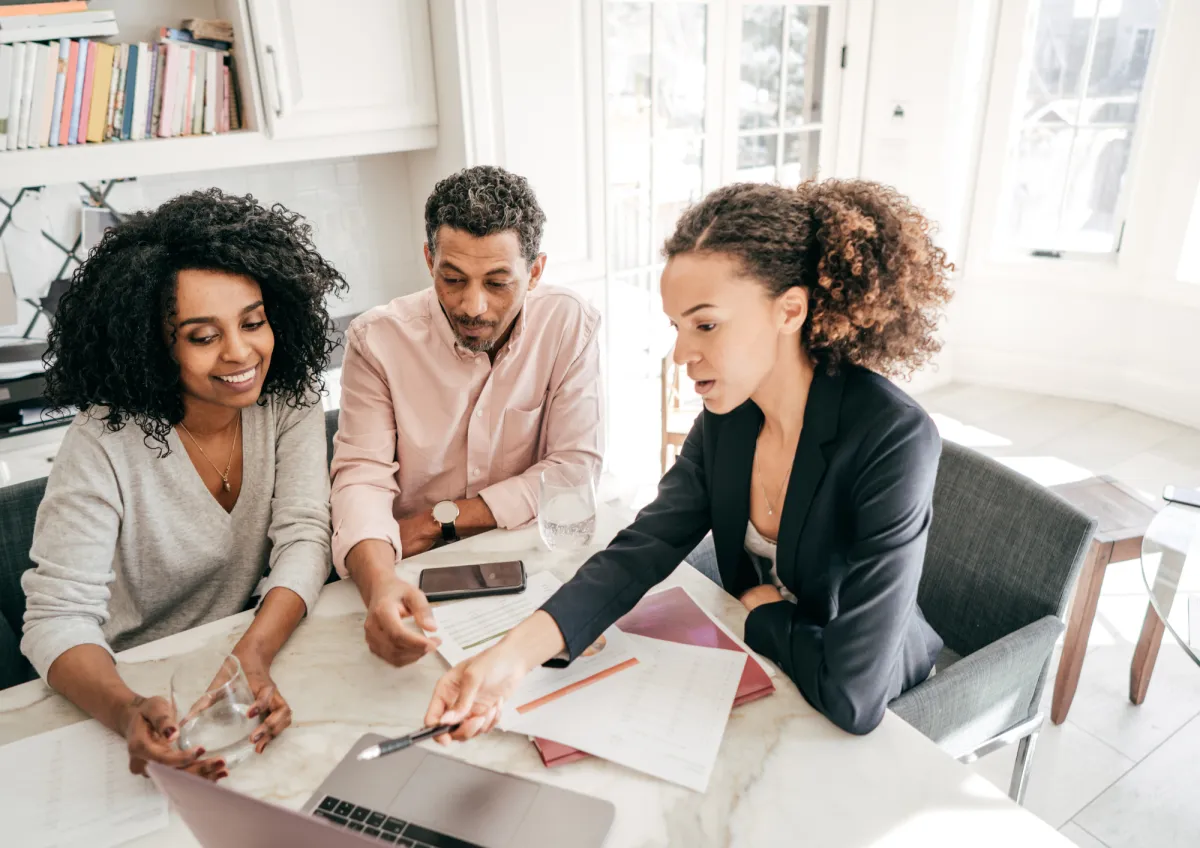 stacked round gold-colored coins on white surface