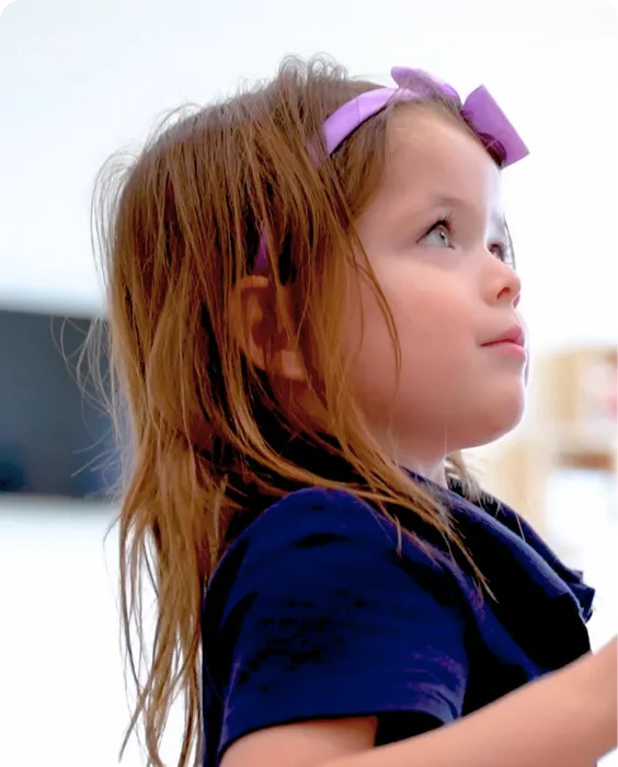 Decorative background featuring a smiling preschool girl with a pink backpack