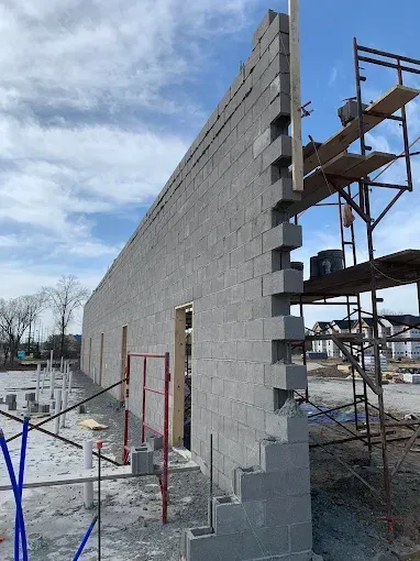 Masonry expert performing mortar joint repair in Missouri