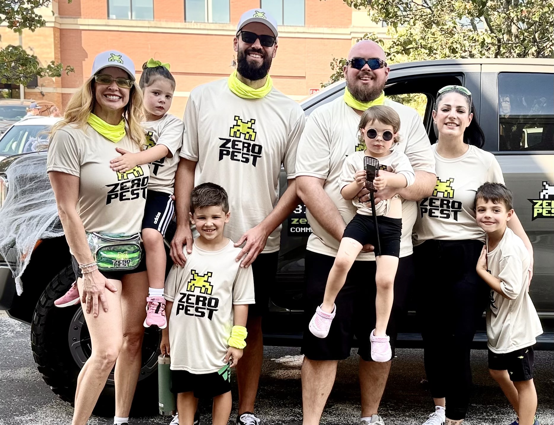 The Zero Pest crew and their families by the Zero Pest truck