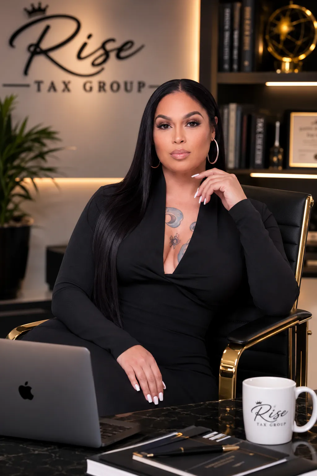Financial specialist organizing business tax documents and reviewing ledgers on laptop