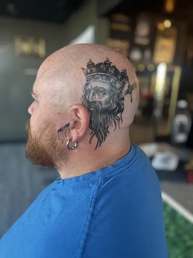 Close-up of a black and grey tiger face tattoo