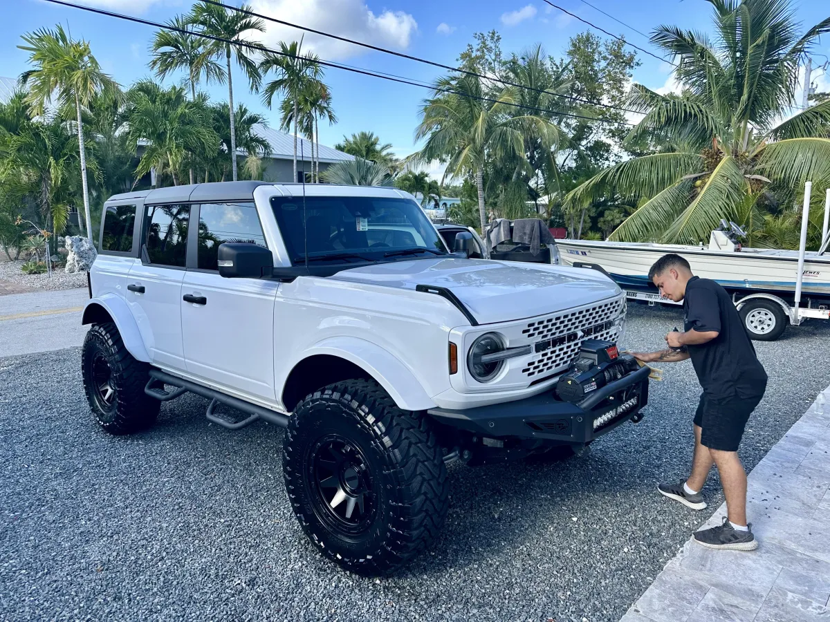 Jesus detailing a Bronco
