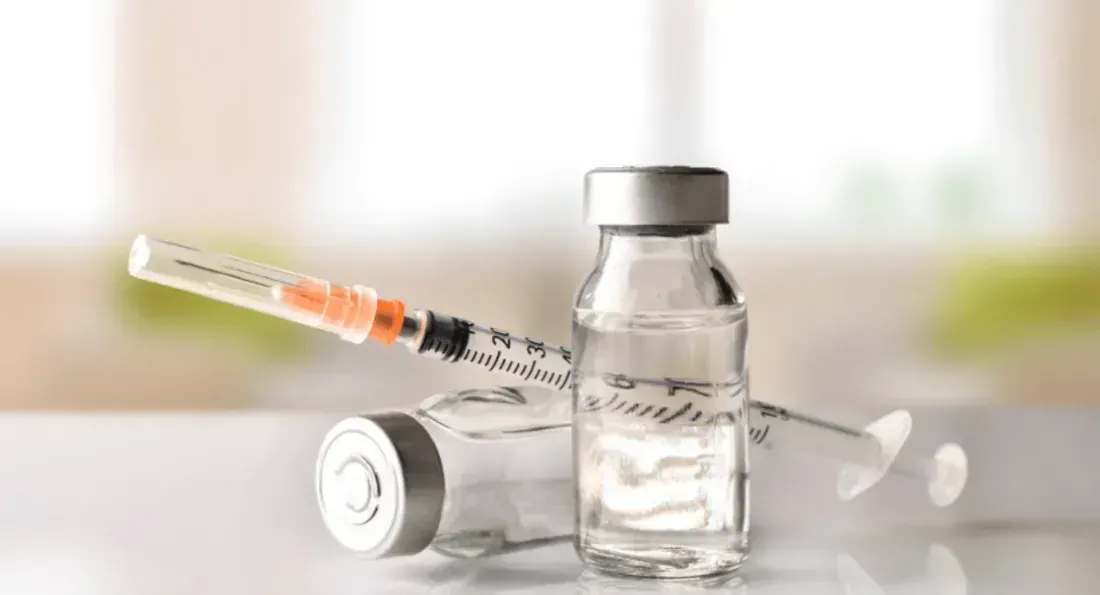 Vials and a syringe for hormone therapy