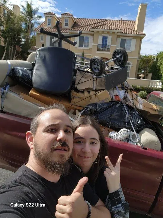 Estate cleanout service by Rabbits Services, with a couple clearing unwanted household items, furniture, and personal belongings in Riverside, Corona, and Lake Elsinore