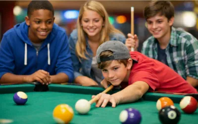 Family playing pool at Owasso Family Billiards