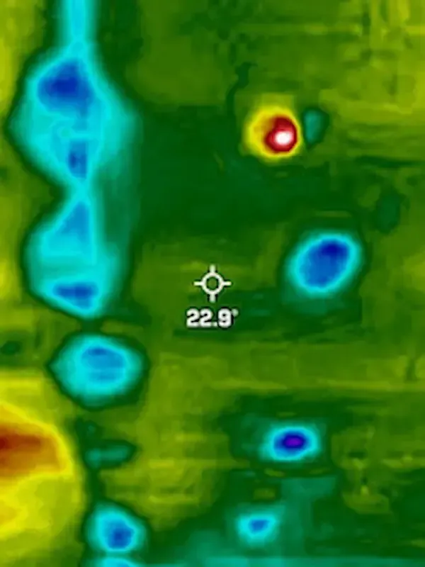 A-OK Roofing's advanced leak detection technology, using thermal imaging to pinpoint hidden moisture infiltration on a flat roof in Toronto. This infrared heat map visualization shows cold, water-saturated insulation in blue and purple, with a temperature reading of 22.9 degrees on a precise leak point. Essential for non-invasive moisture detection and emergency flat roof leak repair across Toronto, East York, and the GTA.