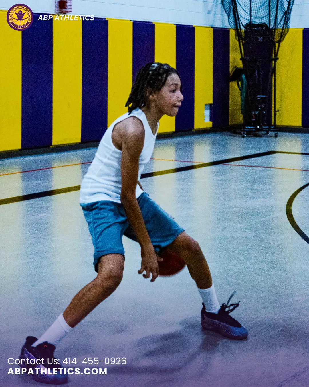 a group of young men playing a game of basketball