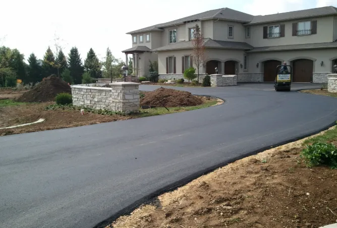 Covered outdoor kitchen with stainless appliances and lighting by Mundo Landscaping Tucson, AZ — custom backyard entertainment space.
