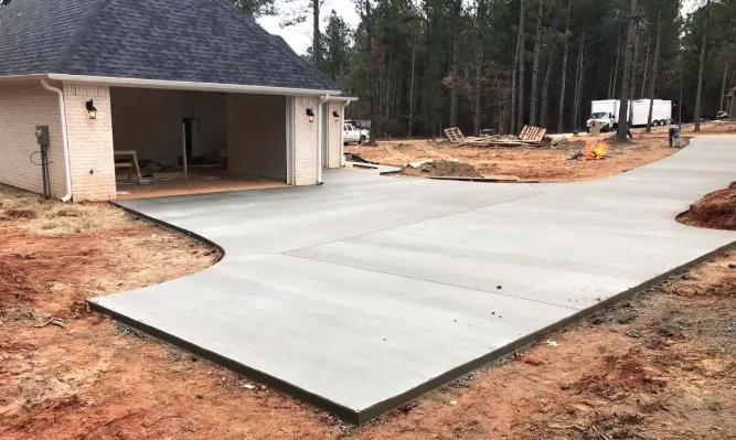 Circular paver patio with built-in fire pit surrounded by greenery — outdoor hardscape project by Mundo Landscaping Tucson, AZ.